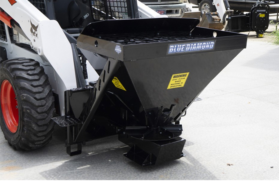 closeup view of the blue diamond skid steer spreader attachment