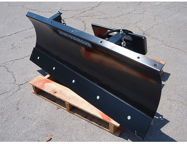 right angled view of a blue diamond skid steer snow blade attachment on a pallet