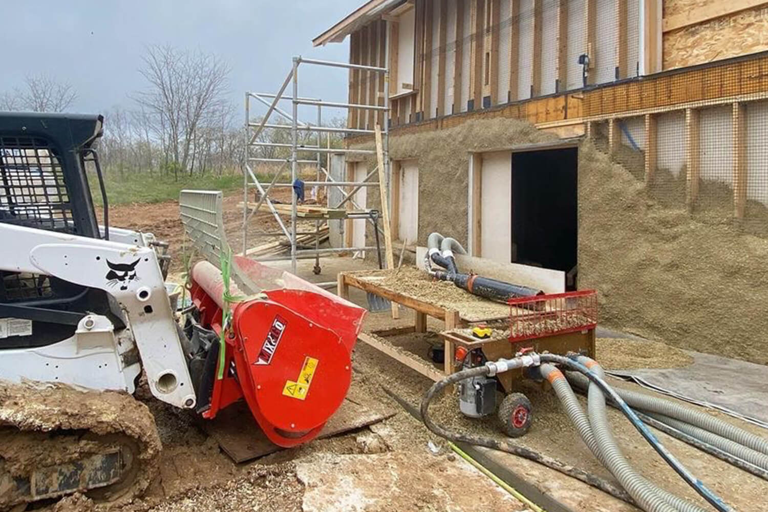 Eterra Concrete Mixer working with sprayer machine to build hempcrete walls